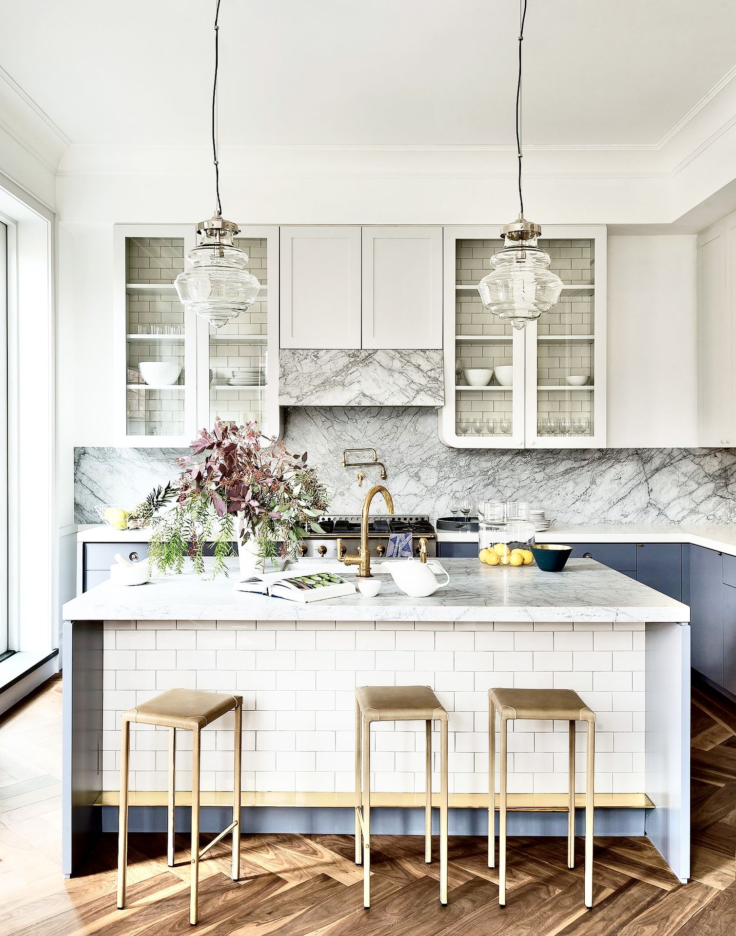 Luxury marble kitchen with gold stools